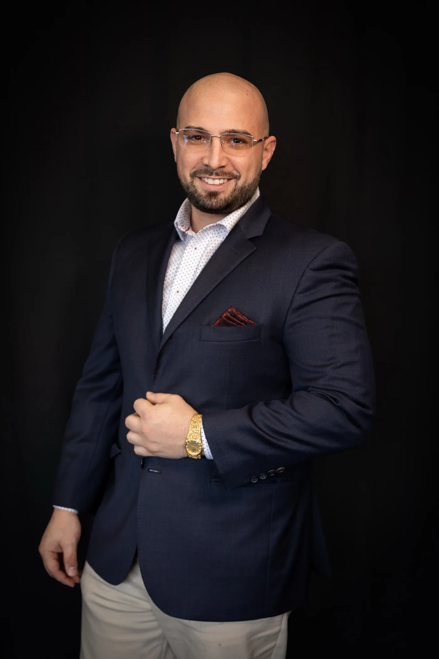 Michael Masters, MK Alliance Group team lead, photographed against a black studio backdrop